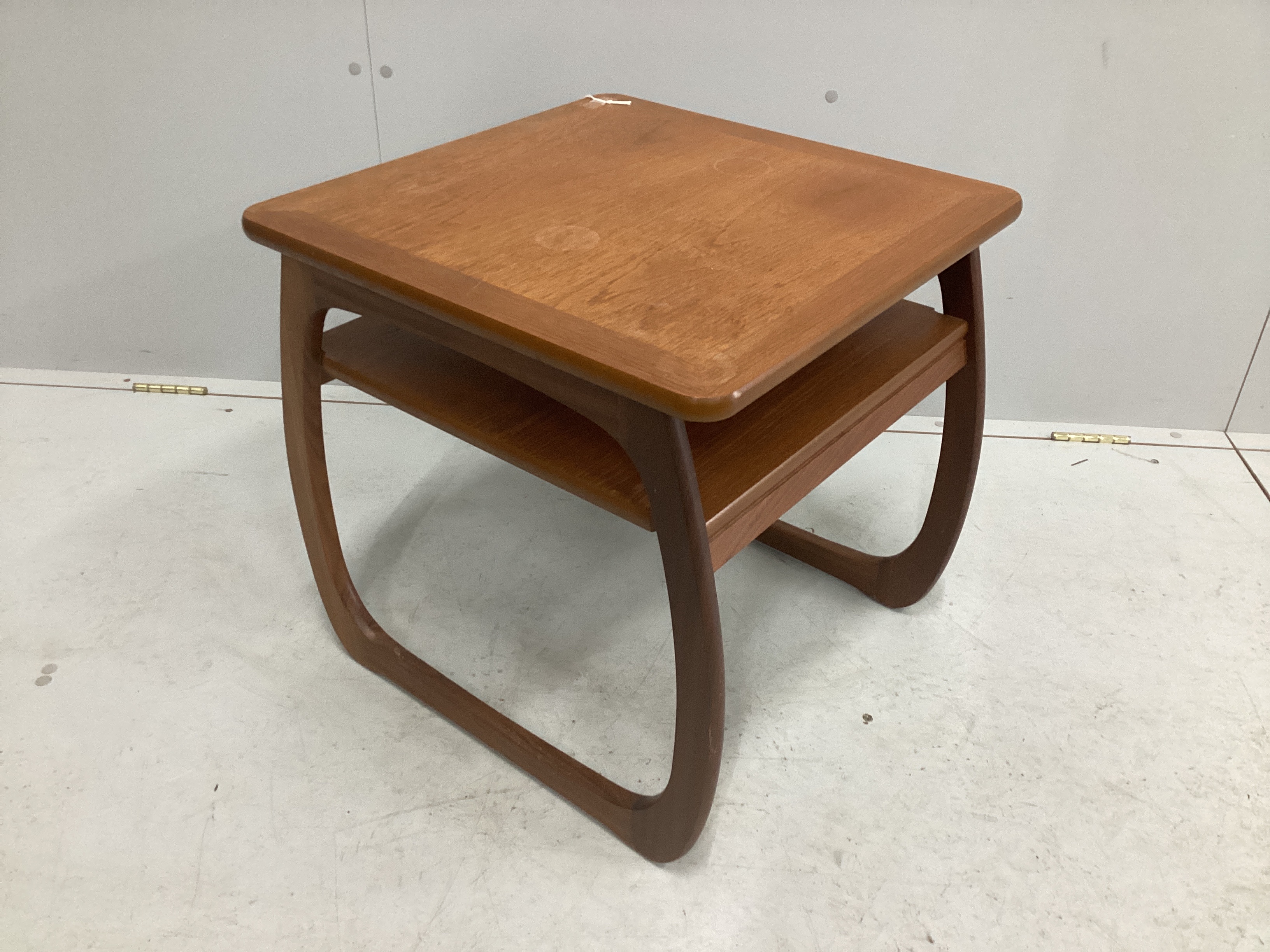A mid century oak and melamine drop flap dining table, width 70cm, depth 68cm, height 73cm together with a Parker Knoll teak two tier occasional table